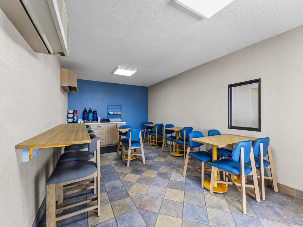 Breakfast area at Park Inn Wells with seating and natural light.